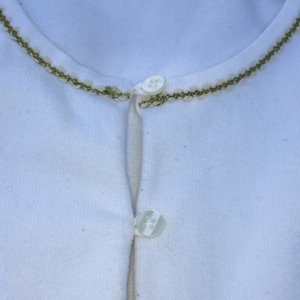 White sweater with green trim around neckline - Picture 3 of 3